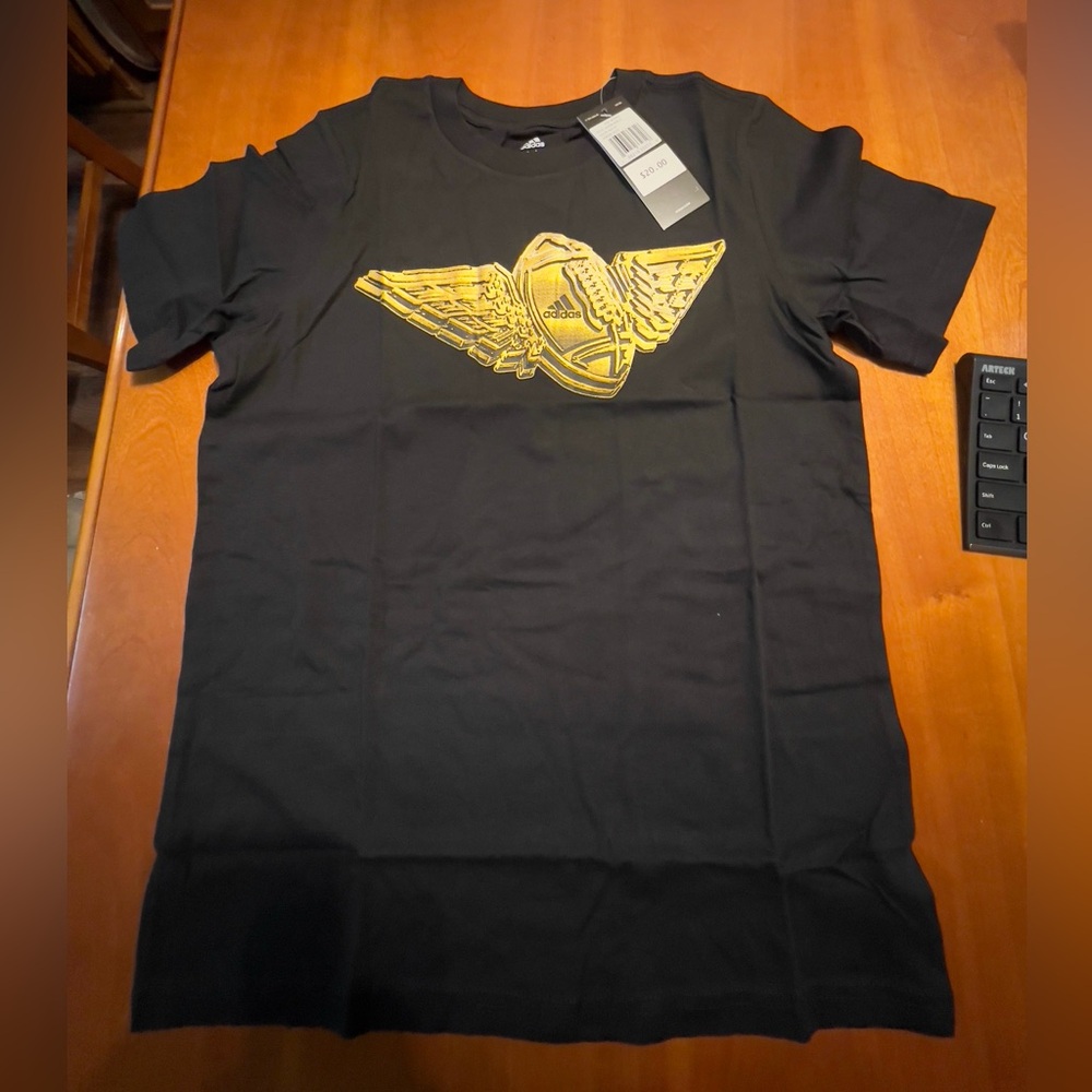 Boys size medium 10/12 Adidas black with gold football wings